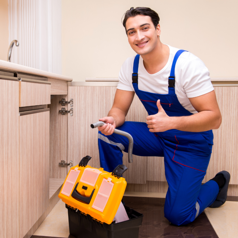 Hubbard Plumber in Blue Overalls giving thumbs up sign